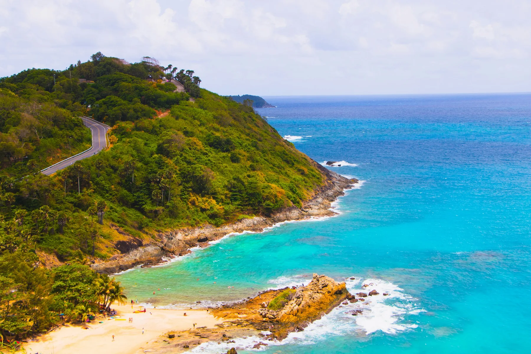 Coastal road above turquoise water near Windmill Viewpoint in Phuket, illustrative destination photograph
