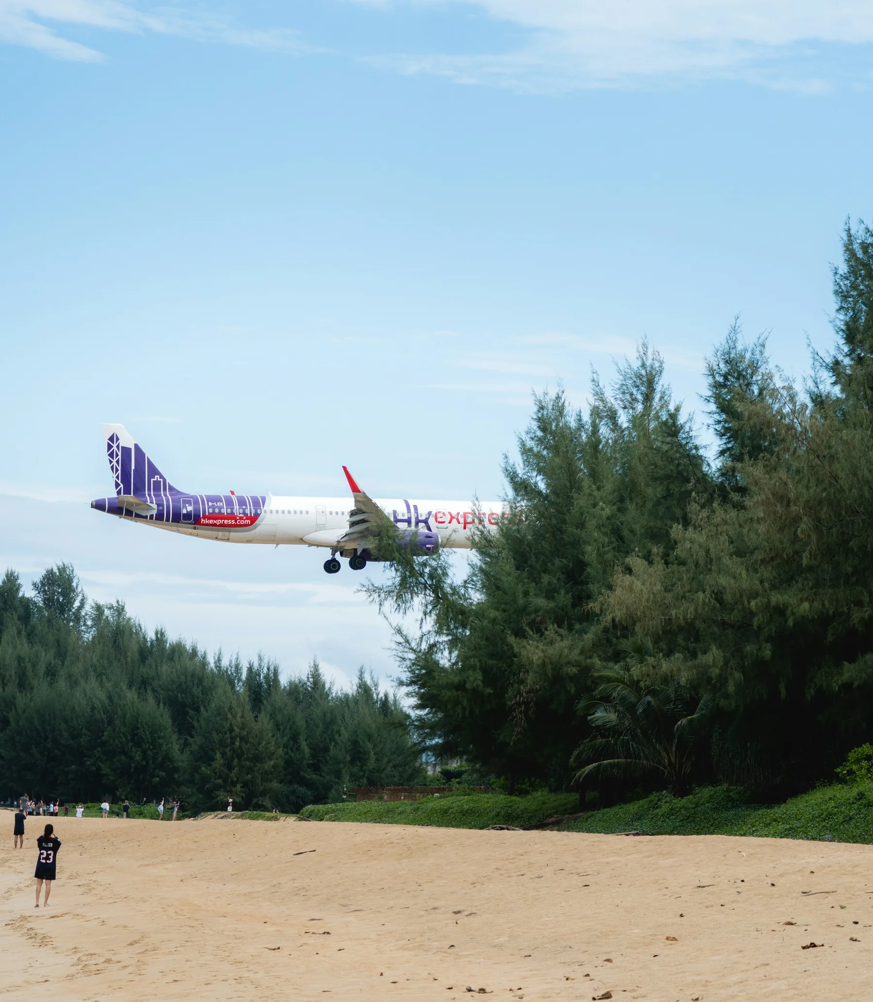 Airplane approaching Mai Khao Beach near Phuket International Airport, illustrative destination photograph